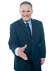 Image showing Confident modern businessman offering handshake