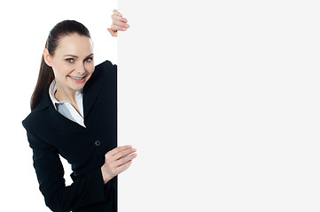 Image showing Female executive holding blank whiteboard