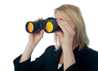 Image showing Female executive monitoring through binocular