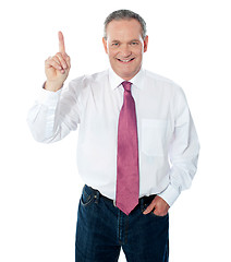 Image showing Smart businessperson pointing upwards