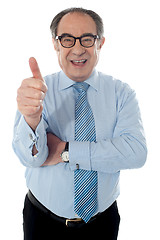 Image showing Matured businessman gesturing thumbs-up