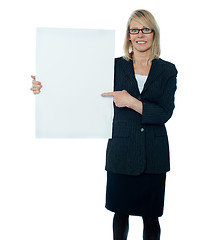 Image showing Business woman displaying placard to camera