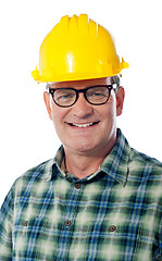 Image showing Closeup of senior architect in hardhat, smiling