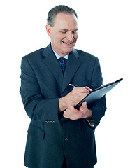 Image showing Elder confident man making business notes