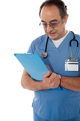 Image showing Medical specialist studying report