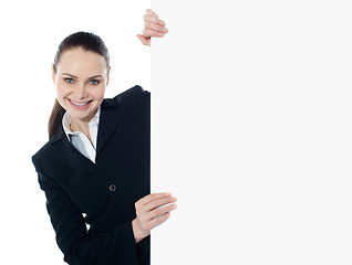 Image showing Businesswoman holding a long banner ad