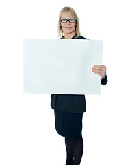 Image showing Corporate lady promoting blank placard