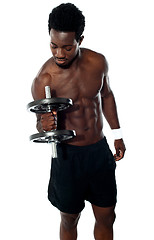 Image showing Young man doing biceps excercise