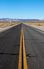 Image showing long highway through desert