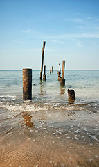 Image showing old jetty pillars in sea