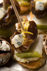 Image showing Appetizer Plate with Dactyl, Pecan nuts and Cheese