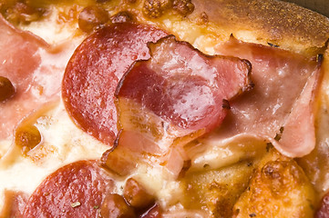 Image showing Italian pizza with bacon, salami and mozzarella cheese