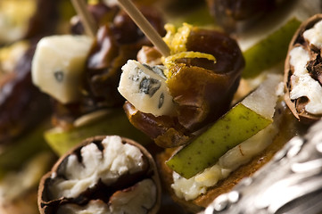 Image showing Appetizer Plate with Dactyl, Pecan nuts and Cheese