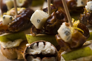 Image showing Appetizer Plate with Dactyl, Pecan nuts and Cheese