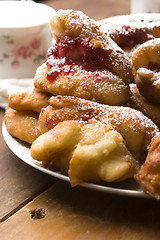 Image showing Sweet doughnuts with rose marmelade