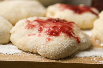 Image showing Dough with marmelade on wooden board