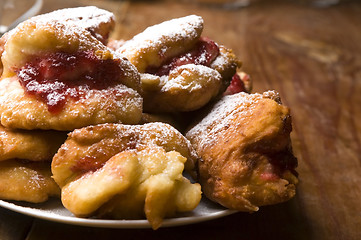 Image showing Sweet doughnuts with rose marmelade