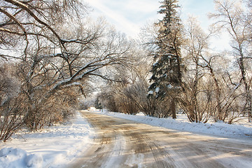 Image showing A snow covered road on a cold winter morning