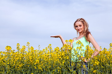 Image showing beautiful blonde girl in a field in summer 