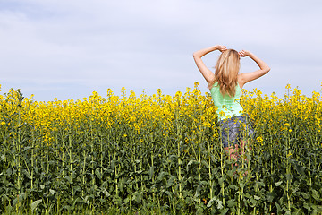 Image showing beautiful blonde girl in a field in summer 
