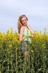 Image showing beautiful blonde girl in a field in summer 