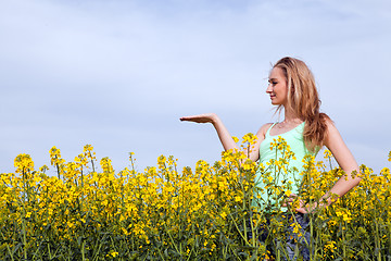 Image showing beautiful blonde girl in a field in summer 