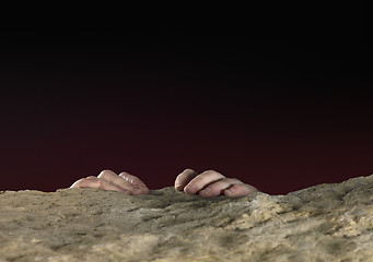 Image showing clutchin hands on stone surface