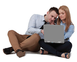 Image showing Young couple working on a laptop