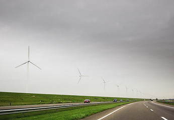 Image showing Wind turbines on highway