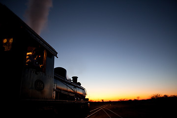 Image showing Locomotive into sunset