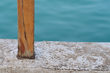 Image showing Brown wooden post