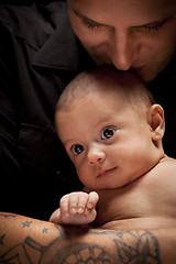 Image showing Young Father Holding His Mixed Race Newborn Baby