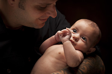 Image showing Young Father Holding His Mixed Race Newborn Baby