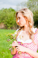 Image showing young woman with pink dirndl outdoor