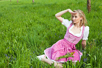 Image showing young woman with pink dirndl outdoor