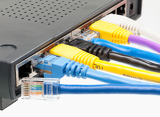 Image showing Cat 5 cables in multiple colors in router