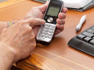 Image showing Man dialing from wireless phone