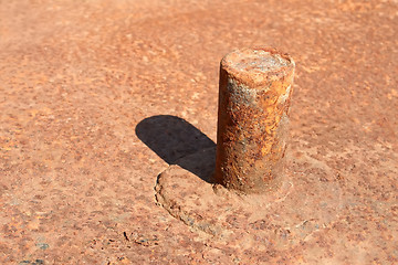 Image showing Rusty pipe welded to platform