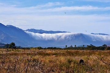 Image showing Mountains in clouds