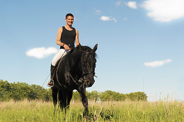 Image showing young man and horse