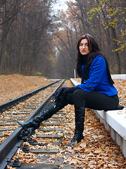 Image showing Young woman near the rails