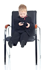 Image showing Little businessman with a phone