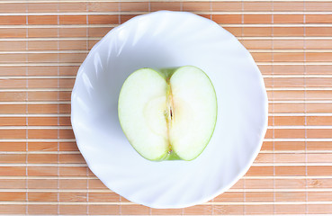 Image showing Half of apple on the plate