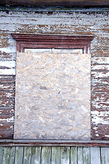 Image showing Abandoned house window nailed-up wood chipboard 