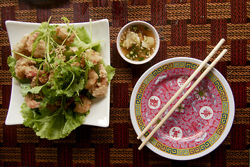 Image showing Asian over brown table with chopsticks