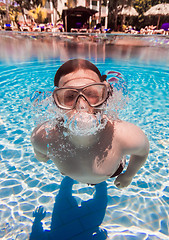 Image showing teenager floats in pool