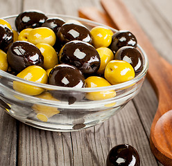 Image showing Olives on a wooden table