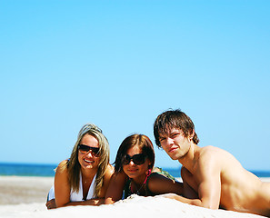 Image showing Young friends on the summer beach