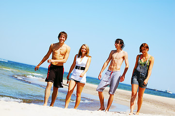 Image showing Young friends on the summer beach