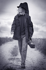 Image showing Young musician walking on the field